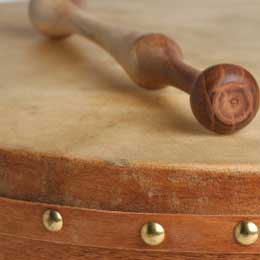 up close of a bodhran with beater