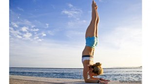 girl demonstrating feathered peacock pose