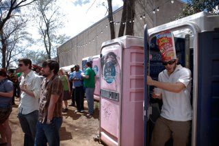 Scott O'Donnell, of Austin, TX, emerges from restroom at Game Streamer celebration presented within Shangri-la on Austin's East Side Wednesday mid-day.