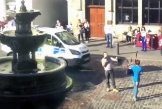 The man is confronted with the young bagpiper given that authorities appear. Picture: added