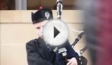 Scottish kid playing bagpipes before rugby match Scotland