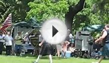 Scottish men in Kilts playing with wood