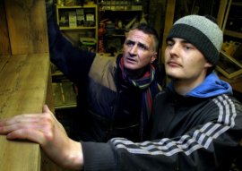 Strip the Willow upcycling centre and cafe: Volunteer Andrew Quinn (remaining) and apprentice Alex Greaves checking a bookcase made of a reclaimed fence